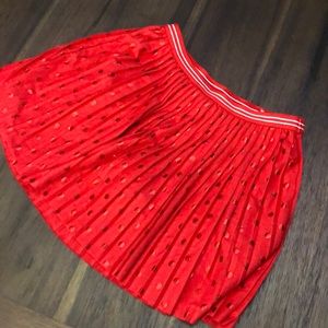 Justice, red skirt .